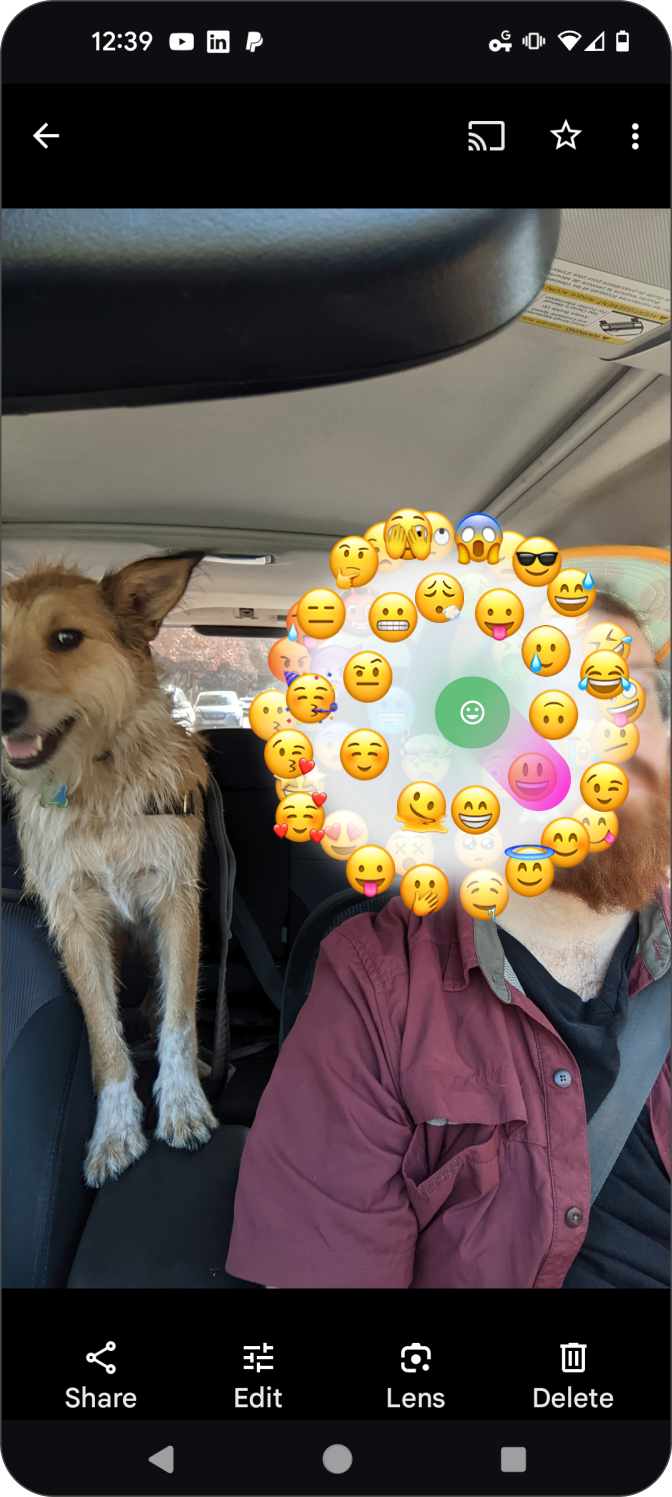 Emoji ring, spin to select target emotion, overlaid on the face